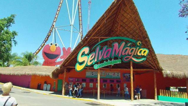 Theme Park Entrance with Thatched Roof and Elmo Figure