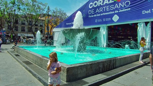 Fountain and People at Outdoor Artisan Market