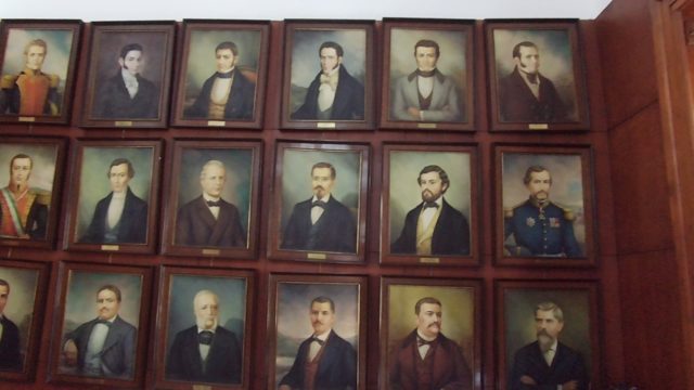 Framed Portraits Arranged on a Wall