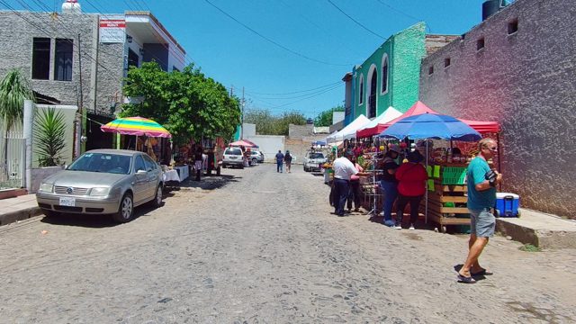 Street Market Activity on Cobblestone Lane