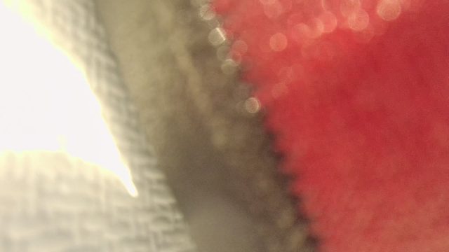 Close-up of Textured Fabrics with Shifting Sunlight