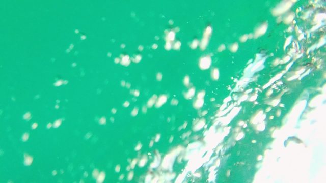Bubbling Water in Red and Green Vessel