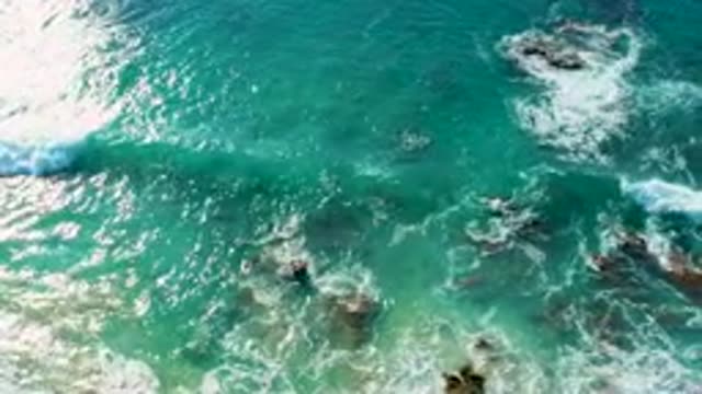 LA FORTUNA EAST CAPE BCS MEXICO-2022: Waves Crashing Against Rocky Ocean Shore