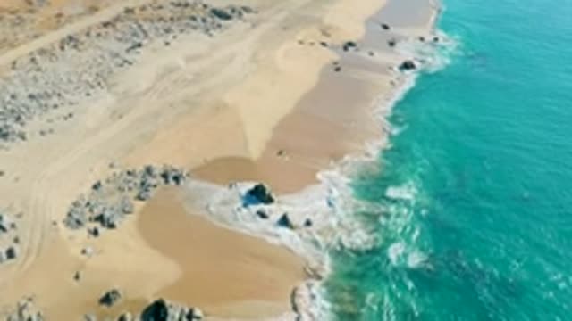LA FORTUNA EAST CAPE BCS MEXICO-2022: Ocean Waves Crashing on Sandy Beach From Above