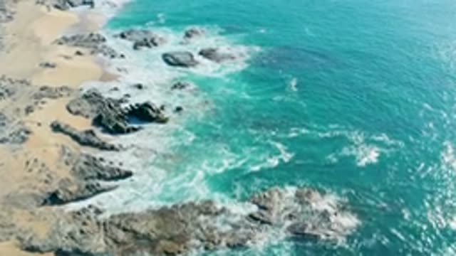 LA FORTUNA EAST CAPE BCS MEXICO-2022: Rocky Shoreline with Crashing Ocean Waves