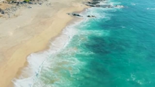 LA FORTUNA EAST CAPE BCS MEXICO-2022: Waves Breaking on Sandy Coast From Aerial View