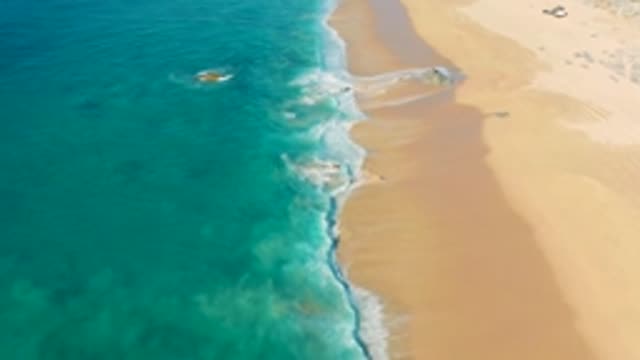 LA FORTUNA EAST CAPE BCS MEXICO-2022: Gentle Ocean Waves Lapping Sandy Shore