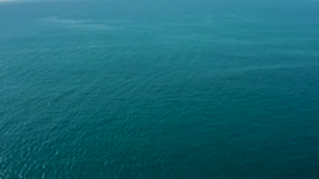 LA FORTUNA EAST CAPE BCS MEXICO-2022: Shifting Sun Glint on Calm Ocean Surface