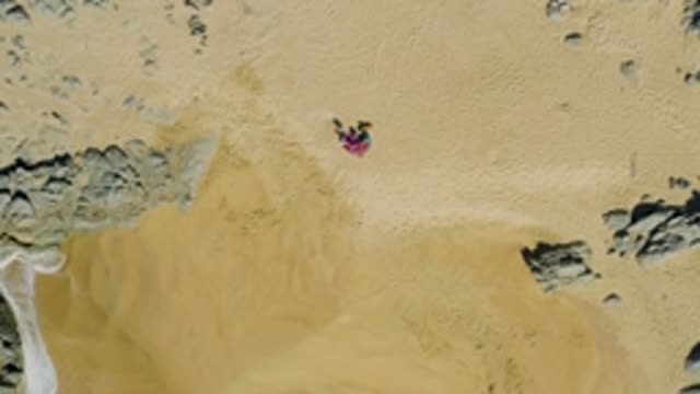 LA FORTUNA EAST CAPE BCS MEXICO-2022: Person Lying on Sandy Beach with Receding Tide