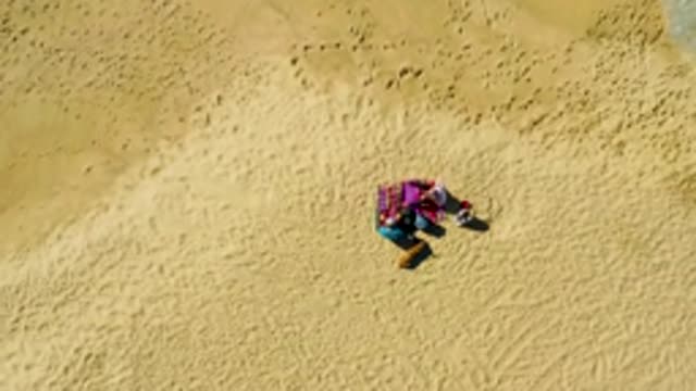 LA FORTUNA EAST CAPE BCS MEXICO-2022: Person Lying on Striped Towel on Sandy Beach