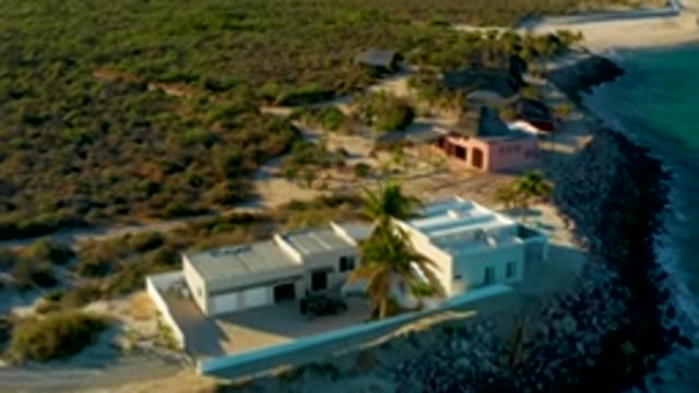 LAS BARRACAS EAST CAPE BCS MEXICO-2022: Drone Flight over Coastal Property with White House and Pink Building