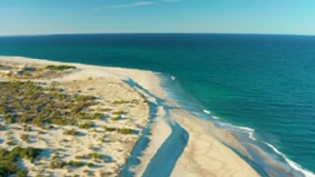 LAS BARRACAS EAST CAPE BCS MEXICO-2022: Sandy Shoreline with Dunes and Gentle Ocean Waves