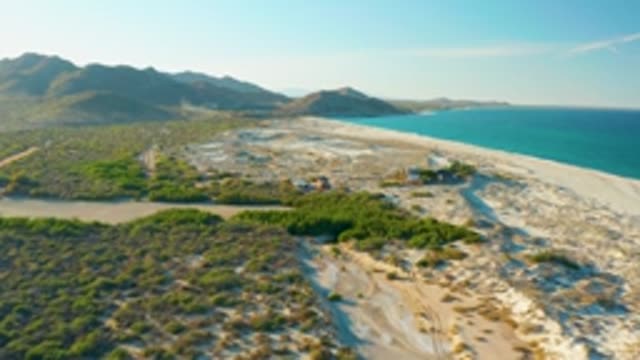 LAS BARRACAS EAST CAPE BCS MEXICO-2022: River Flowing to Ocean Along Sandy Coast