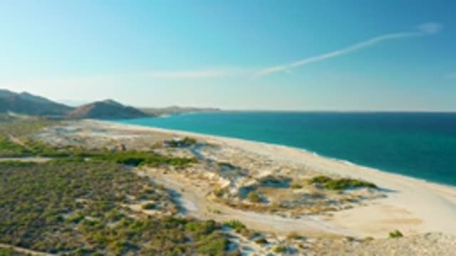 LAS BARRACAS EAST CAPE BCS MEXICO-2022: Vehicle Moving on Sandy Beach Coastline