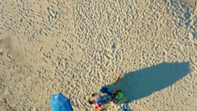 LAS BARRACAS EAST CAPE BCS MEXICO-2022: Sandy Beach with Colorful Gear and Moving Shadow