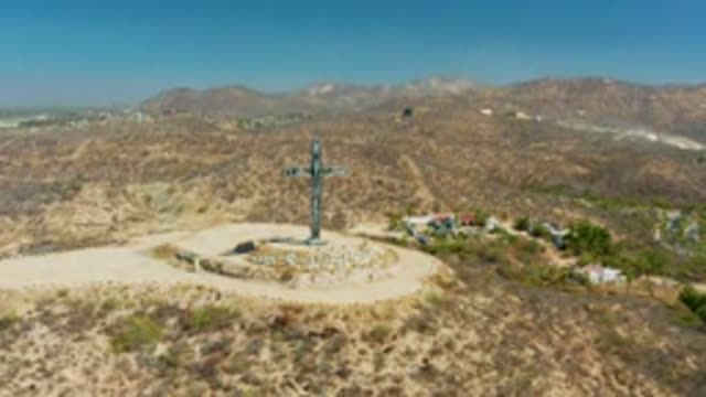 PUERTO LOS CABOS BCS MEXICO-2022: Hilltop Cross in Arid Mountainous Terrain