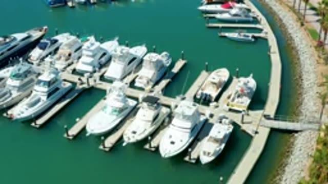 PUERTO LOS CABOS BCS MEXICO-2022: Calm Marina with Docked Yachts and Curved Pier