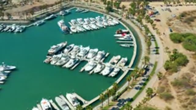 PUERTO LOS CABOS BCS MEXICO-2022: Marina with Docked Boats and Shifting Water