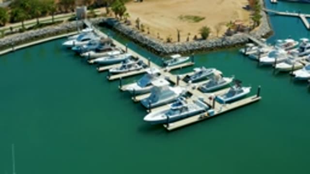PUERTO LOS CABOS BCS MEXICO-2022: Marina with Docked Boats and Calm Water