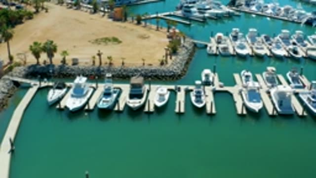 PUERTO LOS CABOS BCS MEXICO-2022: Marina with Docked Boats and Sandy Shore From Above