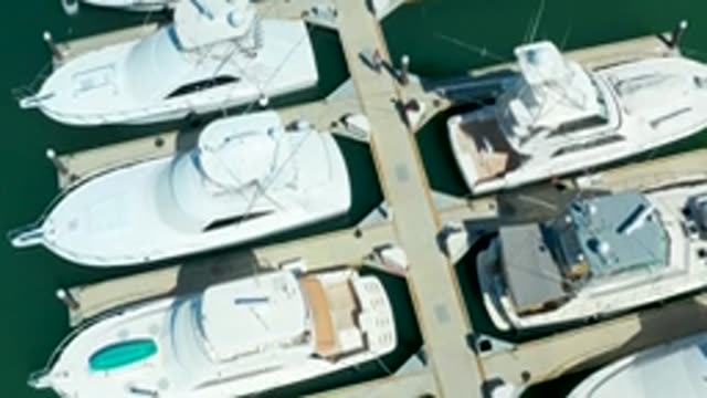 PUERTO LOS CABOS BCS MEXICO-2022: Yachts Docked at Marina with People Walking