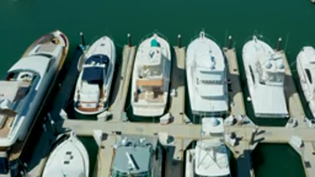 PUERTO LOS CABOS BCS MEXICO-2022: Boats Docked at Marina with Cover Change