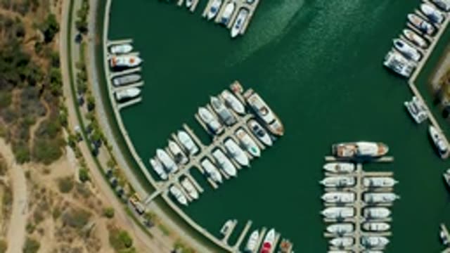 PUERTO LOS CABOS BCS MEXICO-2022: Marina with a Boat Moving Through the Water