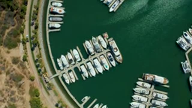PUERTO LOS CABOS BCS MEXICO-2022: Marina with Docked Boats and Moving Vehicles