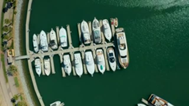 PUERTO LOS CABOS BCS MEXICO-2022: Boats Leaving Marina Dock From Above