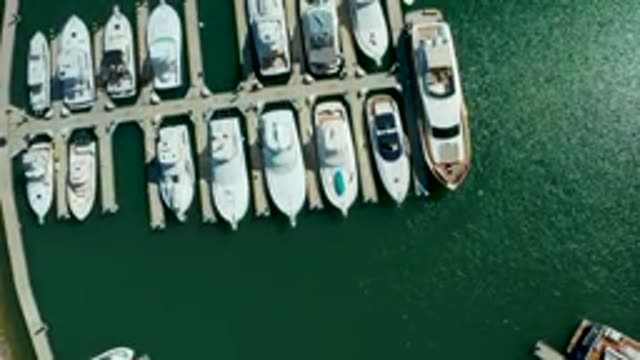 PUERTO LOS CABOS BCS MEXICO-2022: Marina with Docked Boats and Shifting Water Ripples