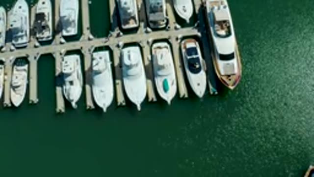 PUERTO LOS CABOS BCS MEXICO-2022: Yachts Docked at Marina As Boats Enter Frame