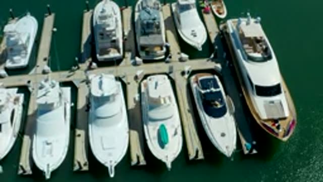 PUERTO LOS CABOS BCS MEXICO-2022: People Walking on Marina Docks Between Docked Yachts