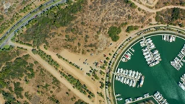 PUERTO LOS CABOS BCS MEXICO-2022: Marina Boats and Moving Vehicles on Road and Parking Lot