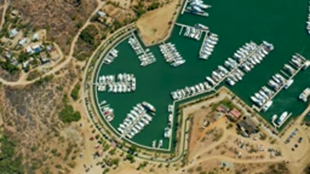 PUERTO LOS CABOS BCS MEXICO-2022: Boats Leaving a Marina From Above