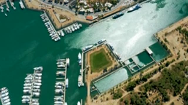 PUERTO LOS CABOS BCS MEXICO-2022: Boats Departing From a Marina Dock