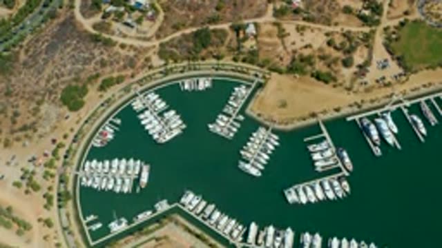 PUERTO LOS CABOS BCS MEXICO-2022: Marina Water Level Receding with Docked Boats
