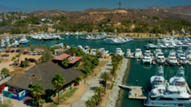 PUERTO LOS CABOS BCS MEXICO-2022: Marina with Boats Moving in Calm Water