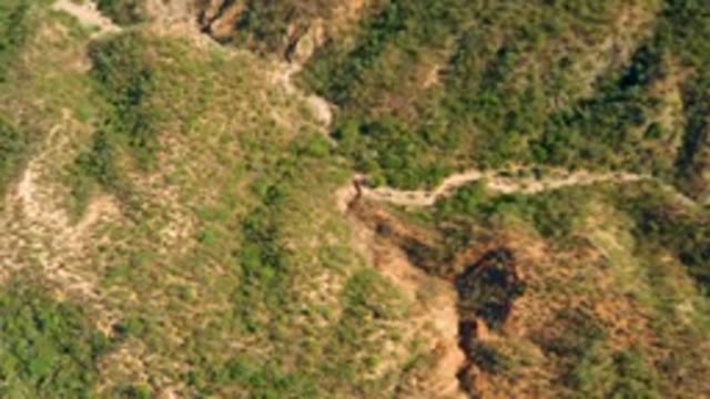 EL SALADO VIEJO LOS CABOS BCS MEXICO-2022: Winding Mountain Road with Moving Figure