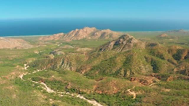 EL SALADO VIEJO LOS CABOS BCS MEXICO-2022: Winding Road Through Mountainous Coastal Landscape