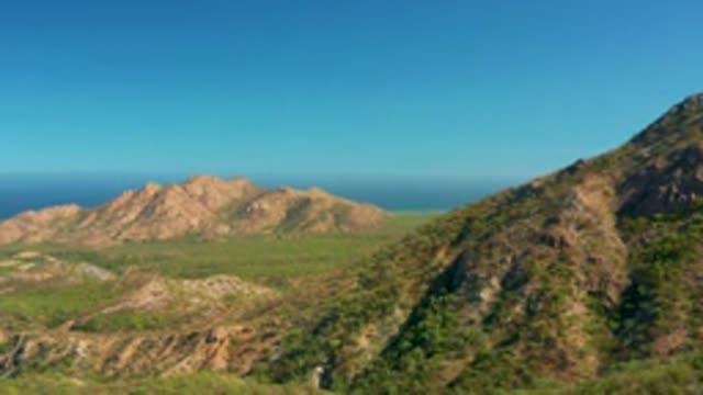 EL SALADO VIEJO LOS CABOS BCS MEXICO-2022: Bird Flying Over Mountainous Coastal Valley