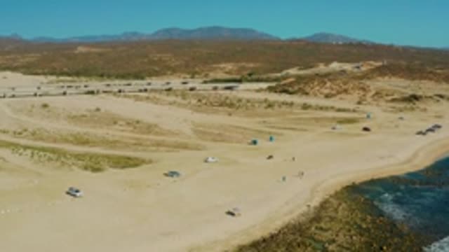 EL TULE LOS CABOS BCS MEXICO-2022: Vehicles and People Moving on Sandy Beach