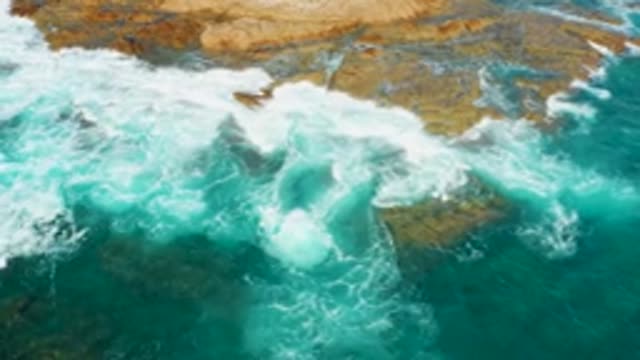 CHILENO BEACH LOS CABOS BCS MEXICO-2022: Waves Crashing on Rocky Ocean Shore