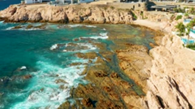 CHILENO BEACH LOS CABOS BCS MEXICO-2022: Waves Breaking on Rocky Shoreline
