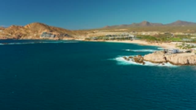 CHILENO BEACH LOS CABOS BCS MEXICO-2022: Coastal Landscape with Rocky Shore and Building