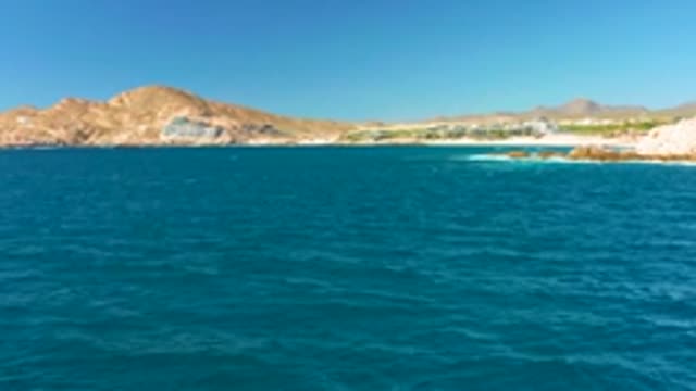 CHILENO BEACH LOS CABOS BCS MEXICO-2022: Gentle Ocean Waves at Rocky Coastline