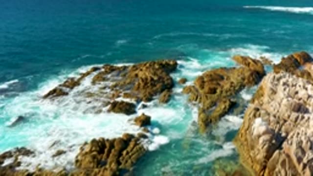 CHILENO BEACH LOS CABOS BCS MEXICO-2022: Waves Breaking on Rocky Coastline From Above