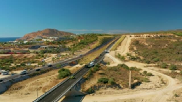 CHILENO BEACH LOS CABOS BCS MEXICO-2022: Vehicles Moving on a Hilly Coastal Highway