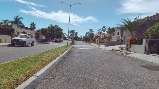 EAST CAPE LOS CABOS BCS MEXICO-2022: Moving Along a Residential Street with Palm Trees