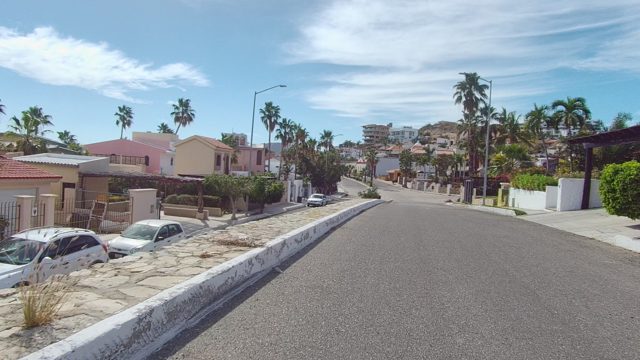 EAST CAPE LOS CABOS BCS MEXICO-2022: Forward View of a Palm-Lined Residential Street