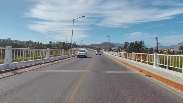 EAST CAPE LOS CABOS BCS MEXICO-2022: Car Driving on a Bridge with Moving Traffic